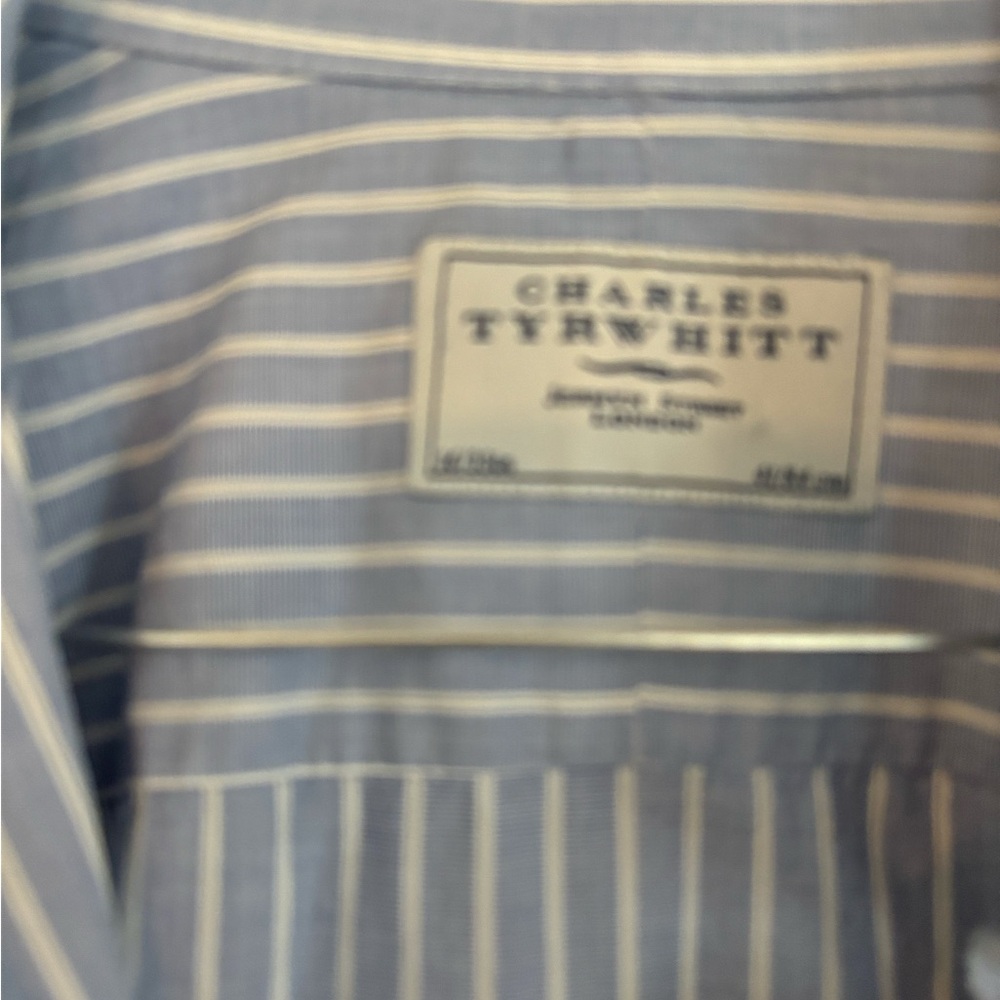 This is a 16x33 Charles Trywhitt blue stripped button down shirt.